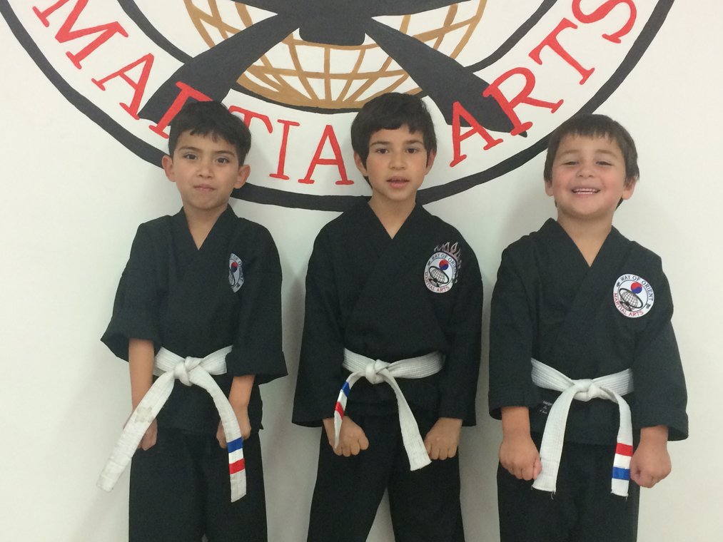 Three students who received their Red, White and Blue stripes